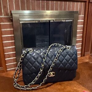 Says Chanel Black Quilted Shoulder Bag with Gold Chain